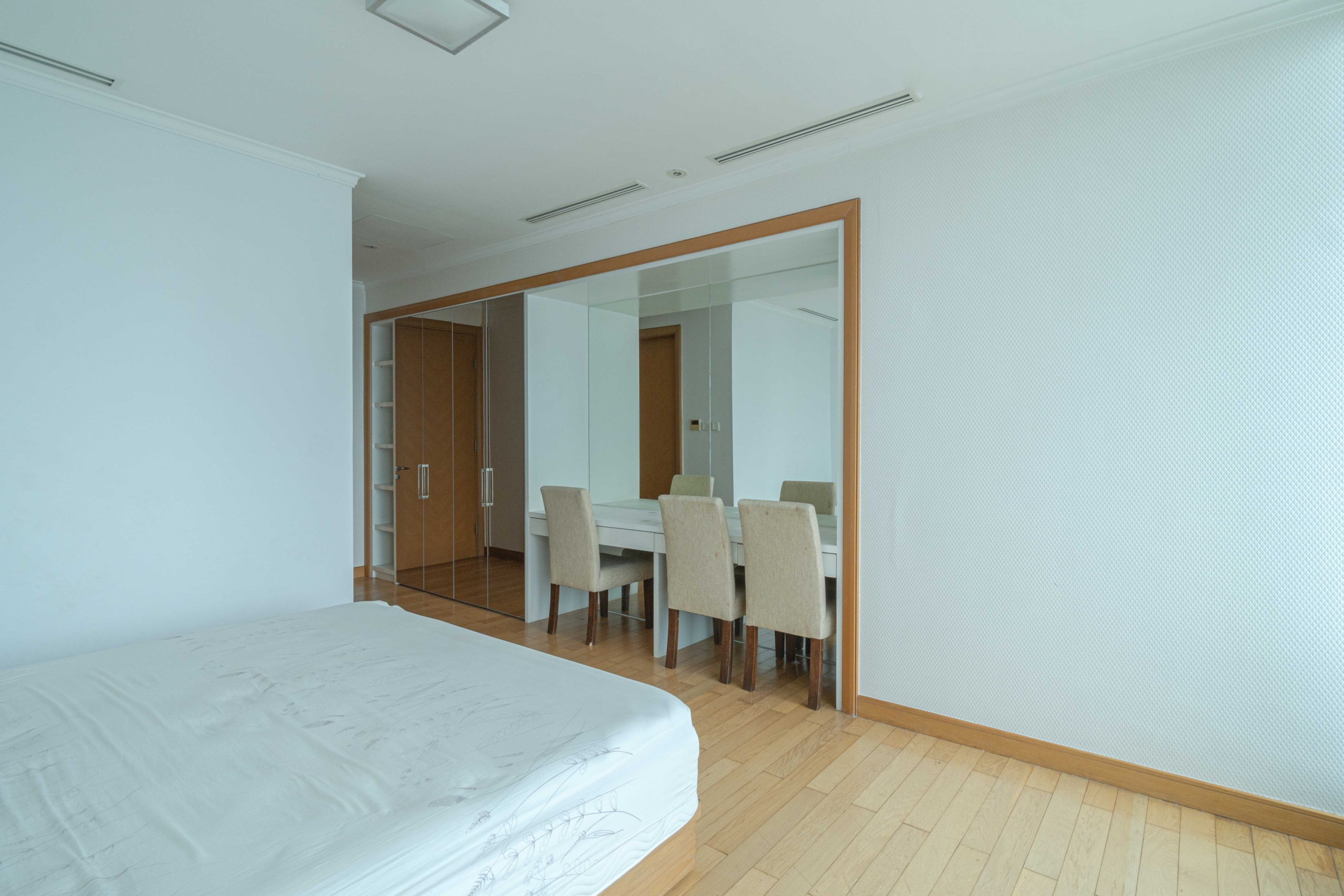 Kempinski Private Residence-4BR-Bedroom mirror and chair Kempinski Private Residence – Elegant Four-Bedroom Living with Direct Mall Connectivity